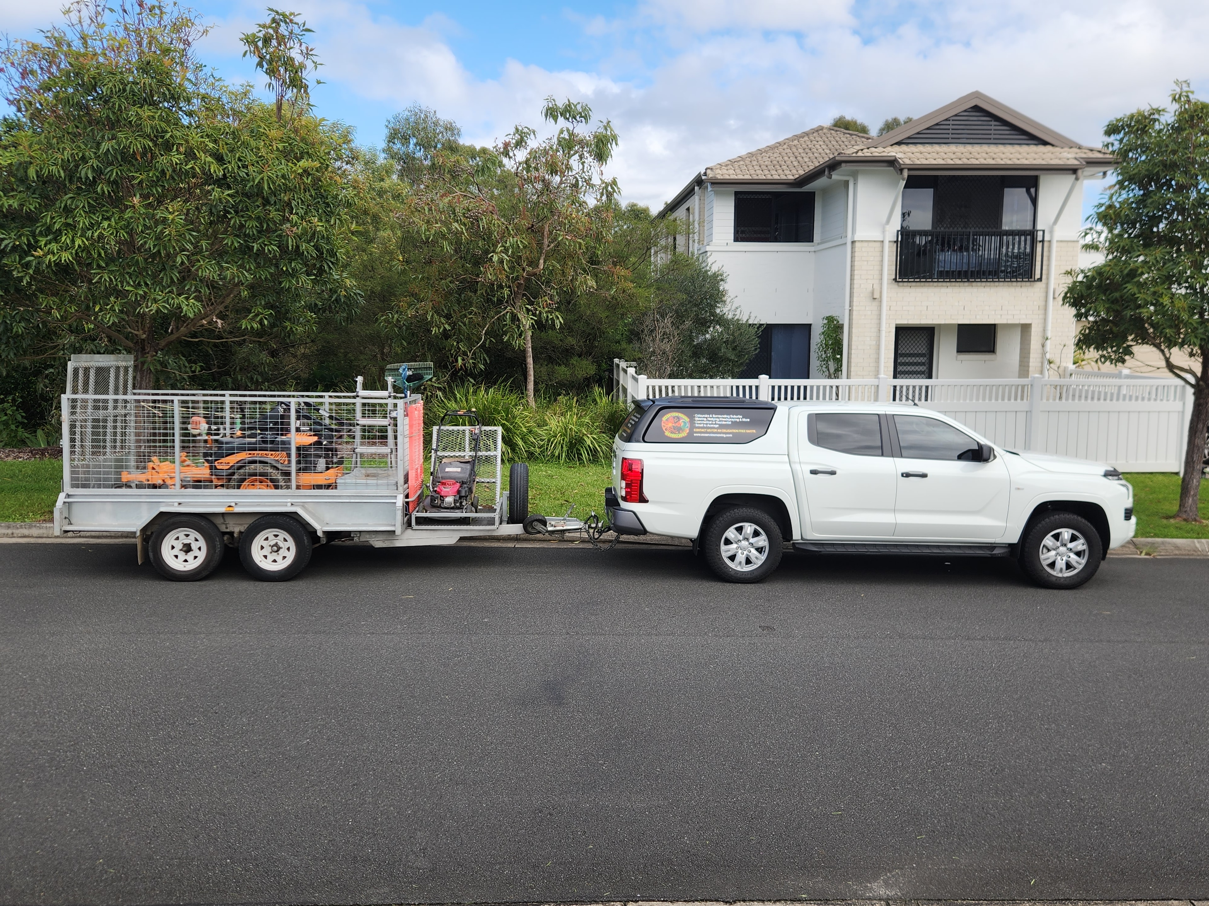 Ocean View Mowing truck and trailer with equipment