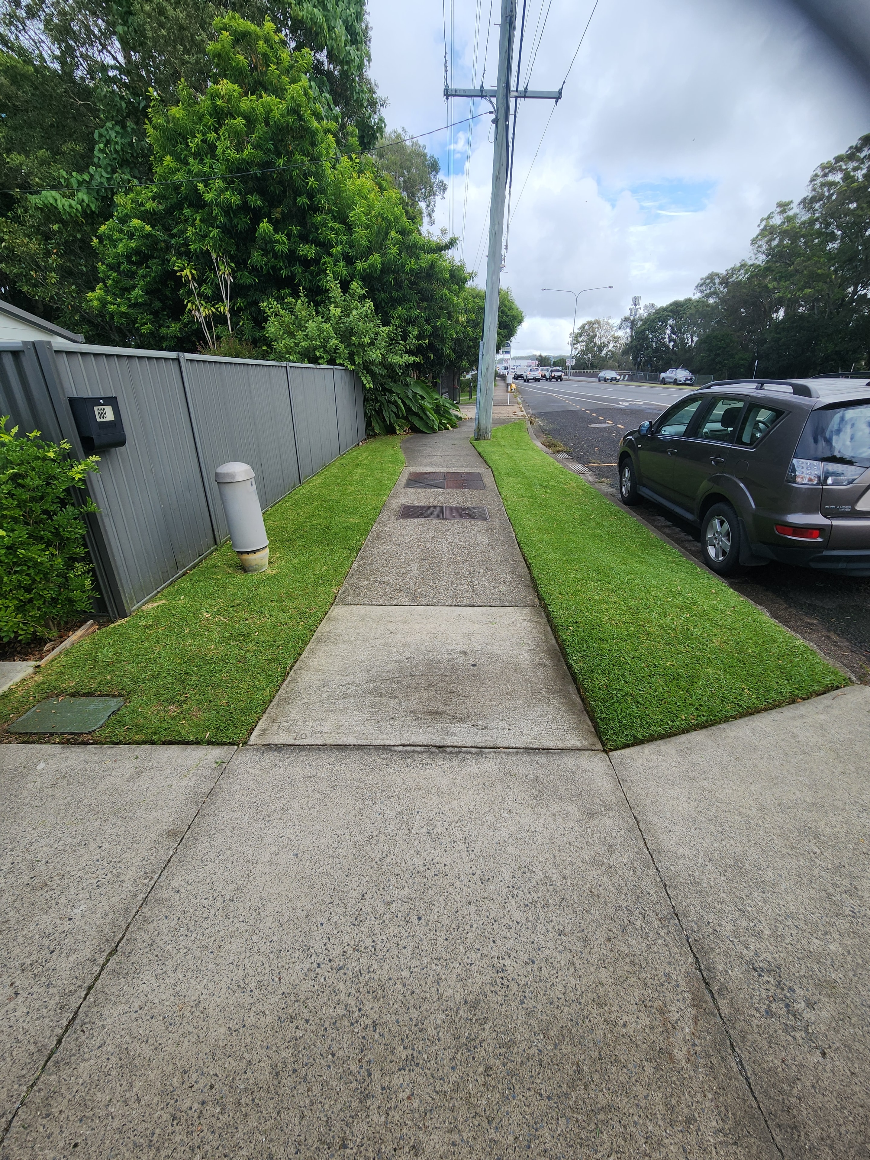 Neatly edged residential lawn and driveway